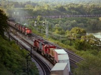 A follow-up to an image posted about 3 weeks back, Starlite CP 5699 and 5790 waiting for the Dofasco Ore train to pass (and followed by a GO train) before heading out over CN via trackage rights toward Toronto. The ore train power is CN 9550, 9582, 9453, 4006 and 5045. All this action took place around 1700-1800.