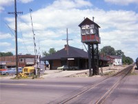 The old Chatham CP station in town at William Street before it was moved to a new location out on the east side to be the focal point of a Nursery. Nice old Watchman's tower makes this scene. Hard to image a job back then just waiting it out, operating the gates, each time a train passed. It must have been a sweaty job in the days before A/C. !!!   It is understood most of these towers were staffed by employees on disability; it gave them something to do and in touch with the railroad. I do not know of any of these operating in the country today. Chatham CP station was built in 1899, but I do not have any idea what year it was moved. Anyone?