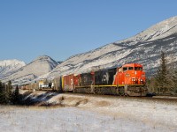 Winnipeg-Vancouver train M301 speeds towards Jasper at track speed behind an almost brand new looking CN C40-8M 2454 and a dirty C40-8W 2137.