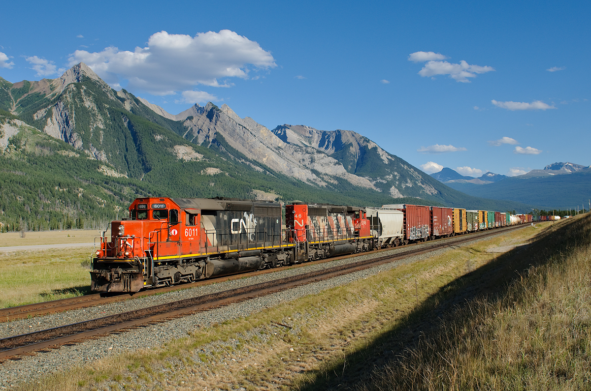 CN SD40u 6011 and SD40-2W 5246 hustle the Hinton-Jasper turn eastward at Henry House.