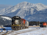 After giving the power a spin on the wye at Jasper, Edmonton-Prince George train M303 prepares for departure behind IC SD70 1036.