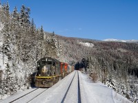 IC SD70 1036 and C40-8W 2458 have just crossed over the Continental Divide at Yellowhead, BC with a 14000 ton M303 in tow for Prince George.