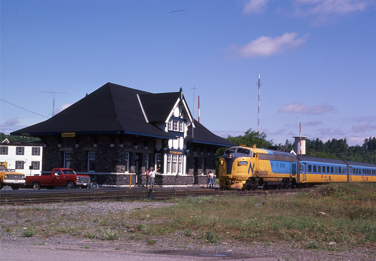It is a nice sunny Thursday morning as the southbound ONR 1986 makes a station stop at the recently refurbished and historic Temagami station. This northland passenger train would be scuttled by an uncaring and unconcerned liberal government on 09/28/2012.