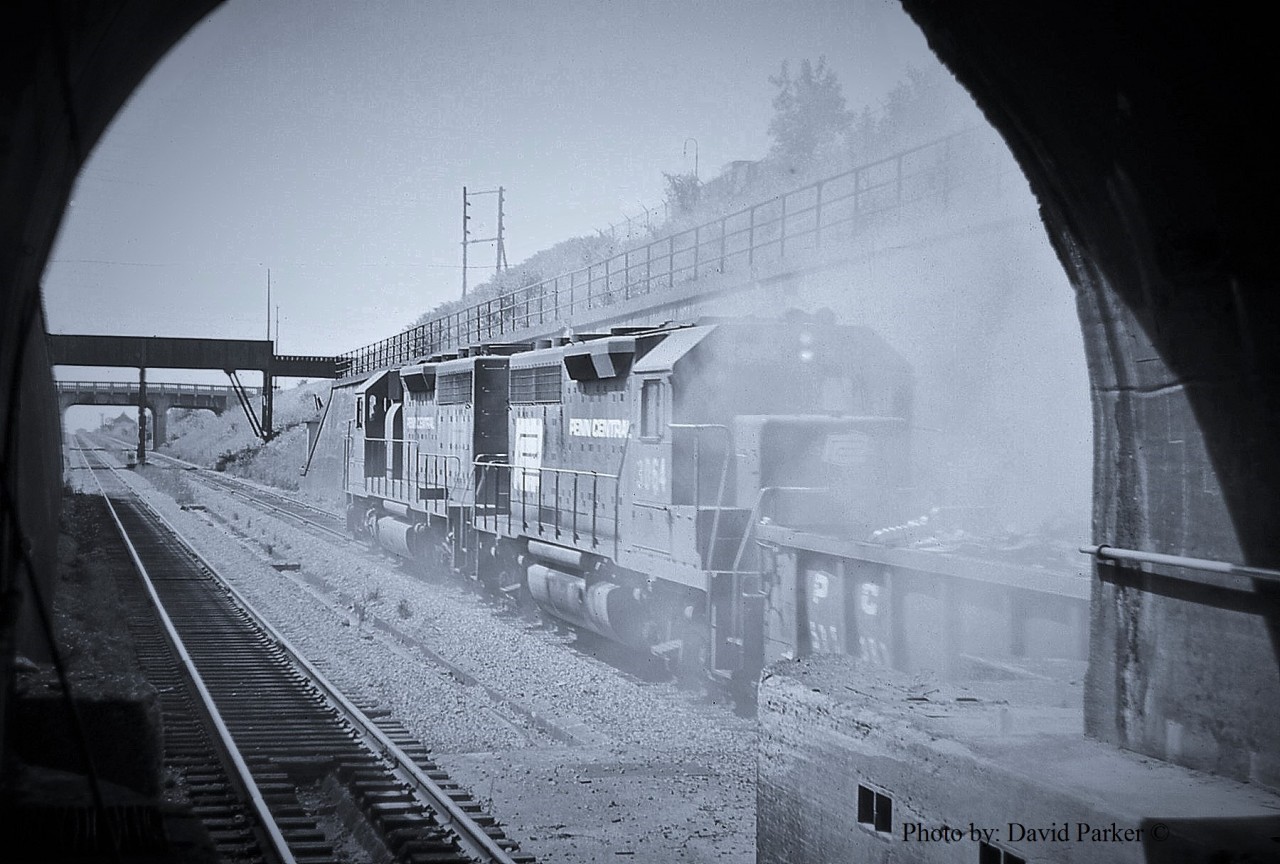 So the story on this shot is I was down by the Tunnel with my camera and some of the M of W guys were working just inside the West Tube.  I think I asked if I could come down and have a look (I would have been 17 at the time) and my request was granted. Some of them knew me from hanging around the depot.  While in there CP-1 was lined thru the East Tube and I took this shot using the old Zenit-E and totally blew the exposure. (This is actually a K-64 colour slide) and the slide was consigned to the "Podunk" shoebox.  Years later I found and scanned the slide and could never get the colour right so turned it into a B&W. 
  Again I'm pushing the limits of the Canada in Railpictures.ca and this is a shot which would probably get you a room at the crowbar hotel these days.