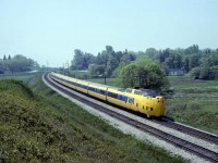  VIA used the higher speed Turbos for a few trains a day between Montreal and Toronto in 1978. Here we see a going away view of the morning westbound almost at the end of it's trip near the Rouge River crossing west of Pickering. It was a fun ride to snag a seat in the bubble and watch the speedometer push toward 100 mph for the just over 4 hour trip. The bubble seats were usually higher priced reserve seats but on the morning runs before the alcohol could be served, they were open seating so that's where I headed.  On one Saturday mornign trip to Montreal, a group of older ladies (were then, would be young partyers now) had the same plan, except they were prepared for Ontario's liquor laws and started passing around a flask.  