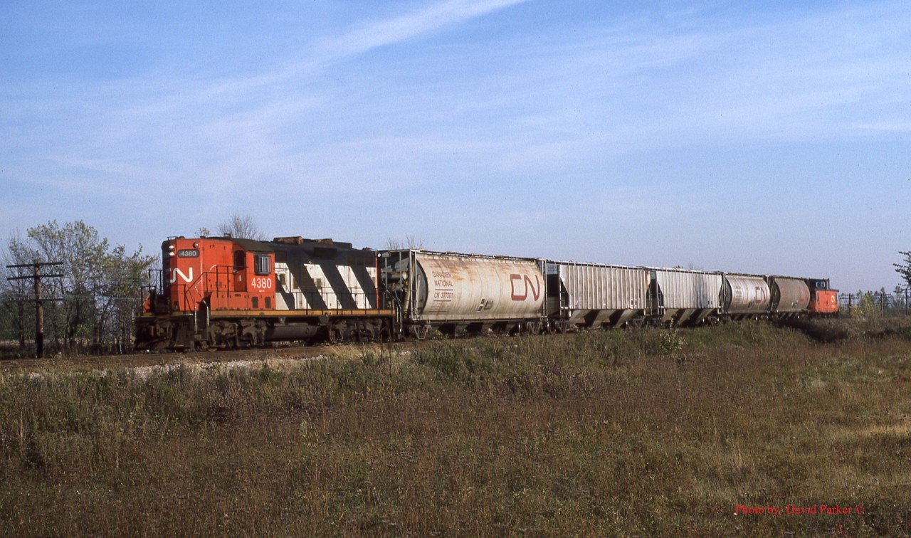 CN wayfreight No 401 continues the tradition of the St Thomas to Windsor "Plug" as it heads West along the Caso Sub at Maidstone, Ont.  The St Thomas crew was made up of ex-Conrail men, some who started their careers with New York Central.  Sadly, the Caso Sub is no more.