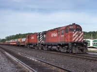 A CP work train consisting of air-dump ballast cars sits tied up at Guelph Jct.