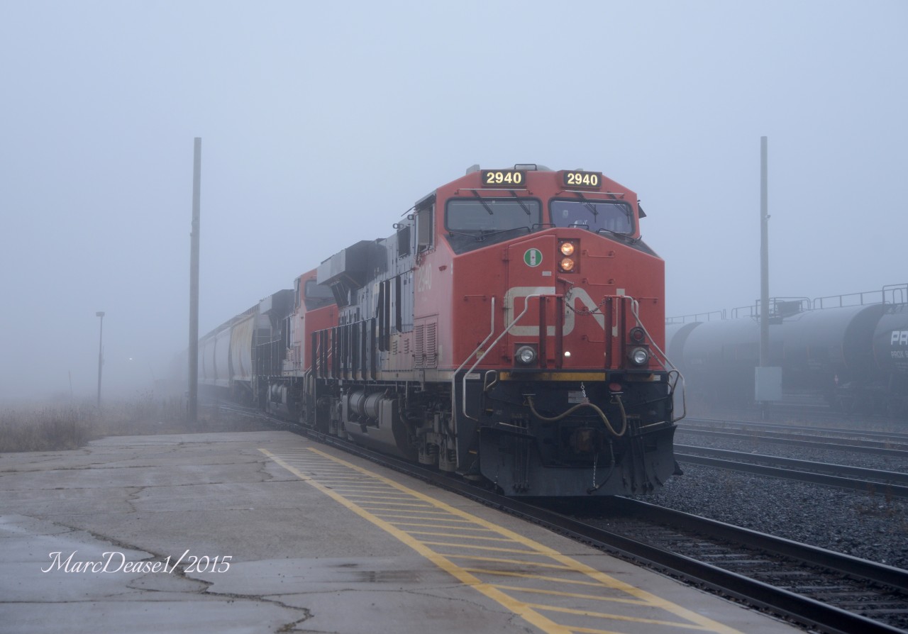 CN 2940 with CN 2872 leading train 397 out of the fog on a slow roll through Sarnia.