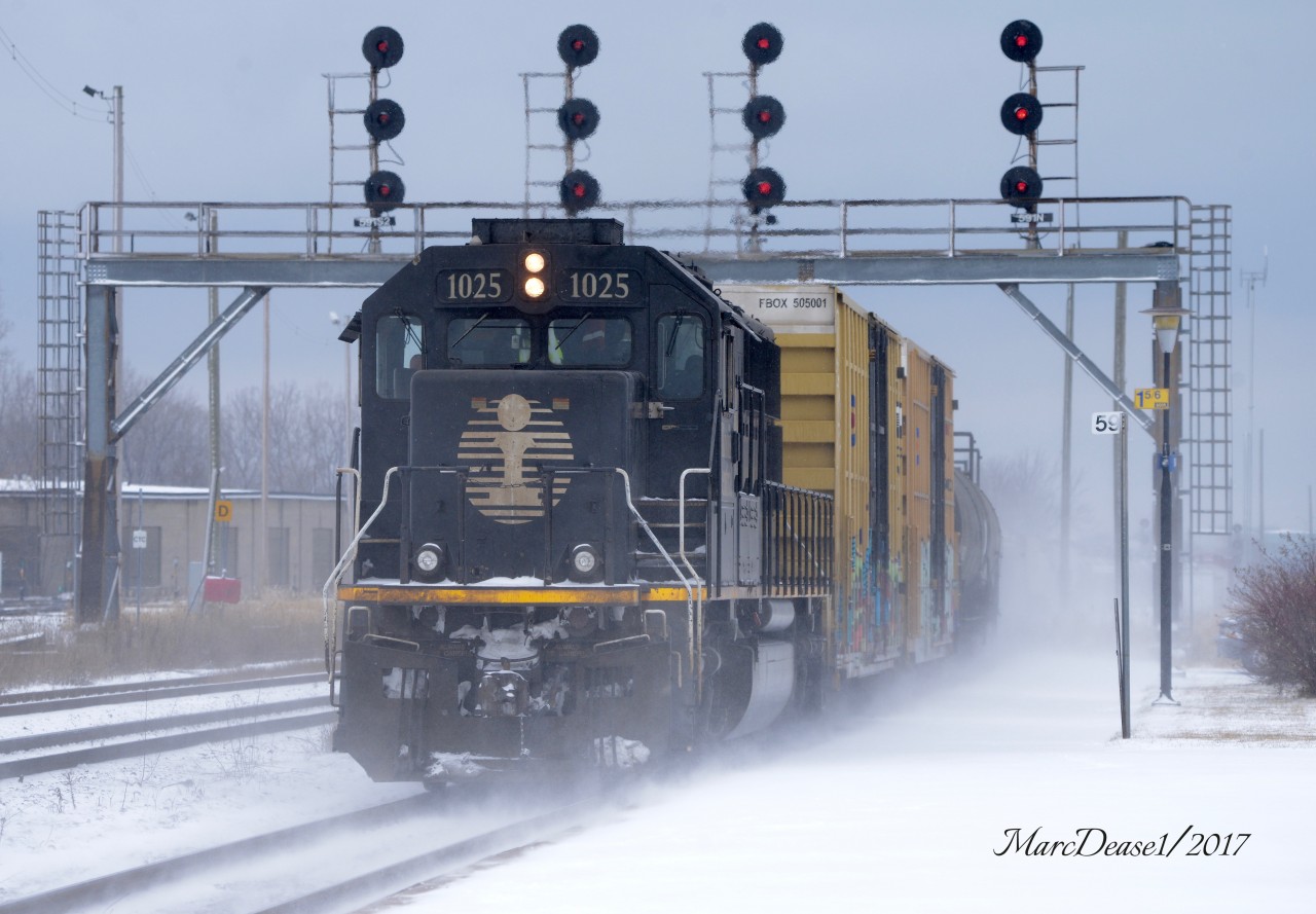 When train 397 stalled on its way out of the St. Clair River Tunnel this morning, IC 1025 got the call to come and assist. After several attempts to push it out it was decided to pull back into Sarnia and then take a running start. Here IC 1025 is on the end of the train pushing back to Port Huron, MI.