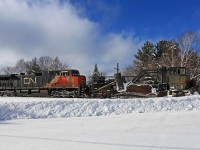 CN ran a Jordan Spreader up the Newmarket Sub from Washago to Huntsville today, first time I've seen one in these parts since about 30 years ago when they used to keep one parked at Martins or in Huntsville Yard to use in the area. There wasn't much for it to do on this part of its run except push back banks a bit more as they were on the heels of a ballast regulator from at least Falkenburg, but it was reported they encountered more snow than expected down south of Bracebridge from the dumping of the other day, so I'm assuming they had to do all the work from Washago to Falkenburg. Here it's seen waiting for the south switch at Martins to be set for the siding so it can do a little clean-up there although the previous crew had already done the bulk of it. 