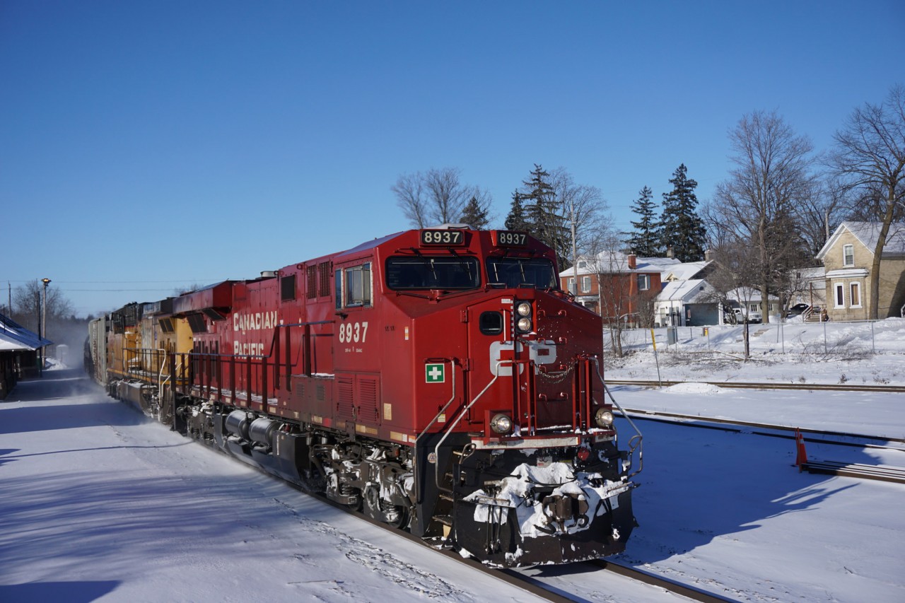 On a cold Sunday morning CP Train 646 rolls through Cambridge with a Union Pacific unit trailing.