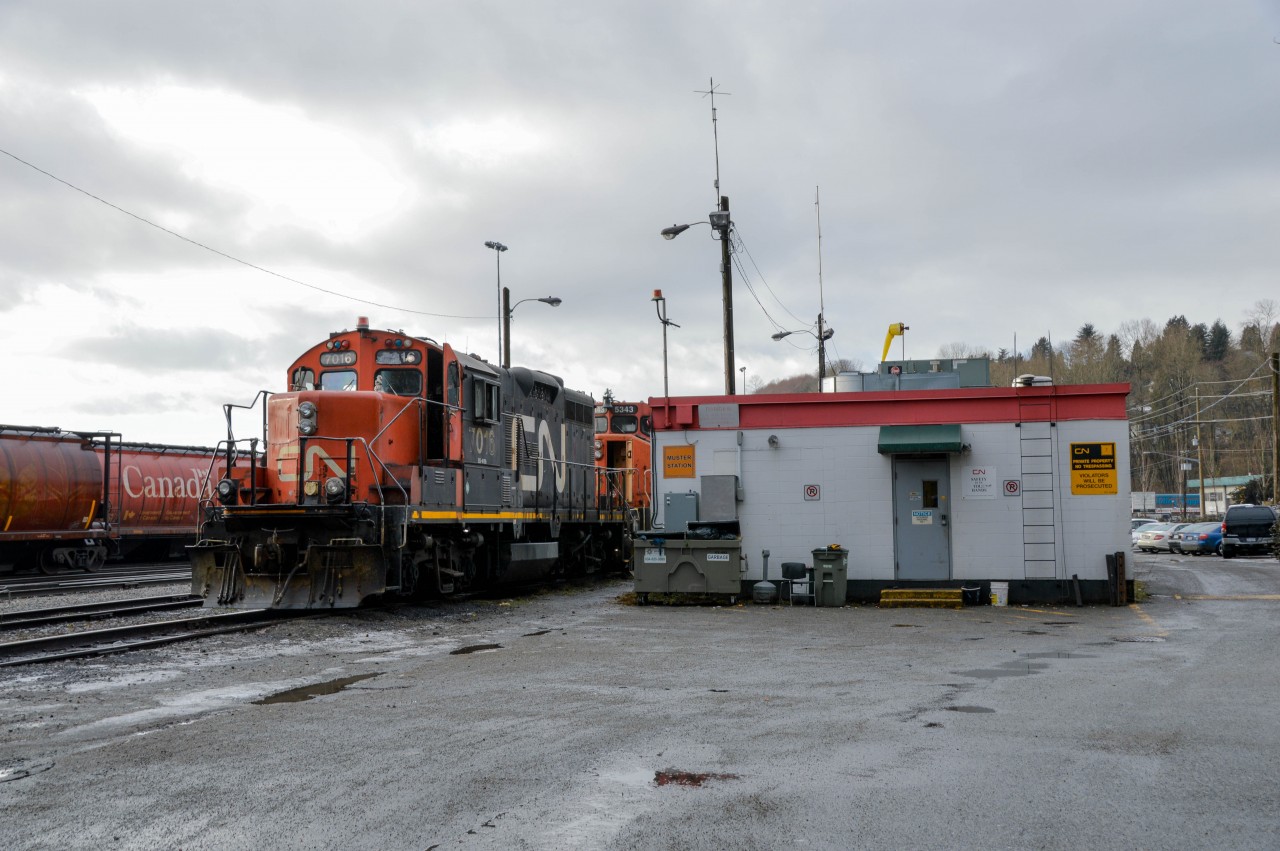 Veteran EMD's sit beside the Lynn Creek Yard office, waiting the call to action.