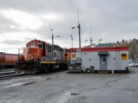 Veteran EMD's sit beside the Lynn Creek Yard office, waiting the call to action. 