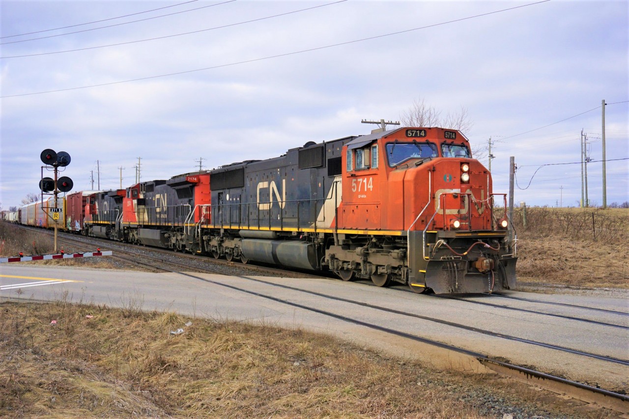 Three units lead M394 pass Mile 27.1 shortly after a Sperry Rail Service also heading east went past on the South track.