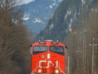 A solo CN 2957 takes charge of southbound L568 on the approach to Squamish yard.