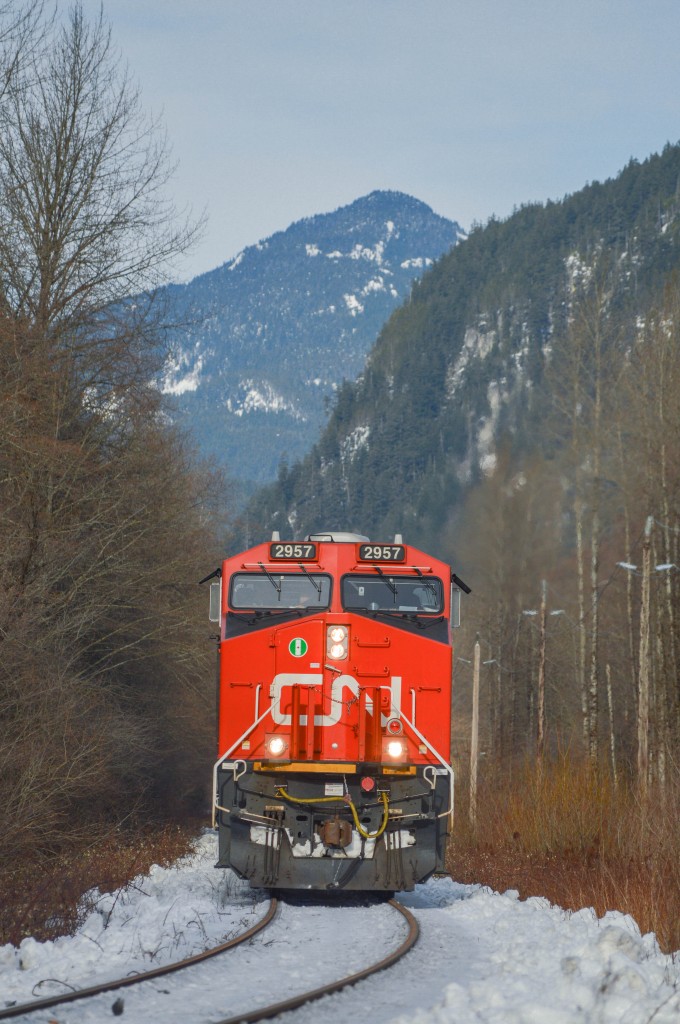 A solo CN 2957 takes charge of southbound L568 on the approach to Squamish yard.