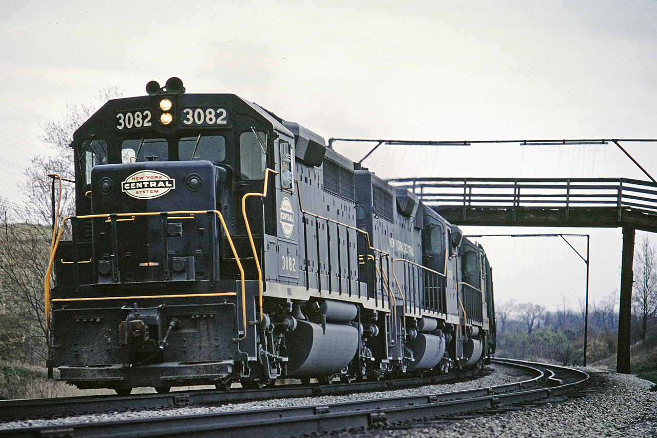 CASO Sub Westbound NYC 3082 rounds the curve under the farmer's wooden bridge at Clanbrassil, ON. in May 1968.  The tracks are long gone but the roadbed is still visible on Google Maps.