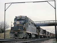 NYC NY4 was always identifiable by the stock cars at the head end.  Here, GP30 2193 is leading 3 GE U25B's as the train rounds the curve under the wooden farm bridge at Clanbrassil on the old Michigan Central.  