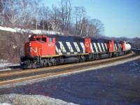 Just a nice clean shot of a trio of GP40-2L(W) heading west thru Bayview Jct on a nice sunny Wednesday morning many moons ago. CN 9457, 9599 and 9554 made for a commonplace photo back then, but they have a nostalgic appeal these days. I enjoyed weekdays at the Jct because it was far less busy with various railfan automobiles parked every which way.