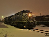 Soon to be returned to CEFX as an end of lease return, 1023 lights up the blowing snow on the shop tracks.