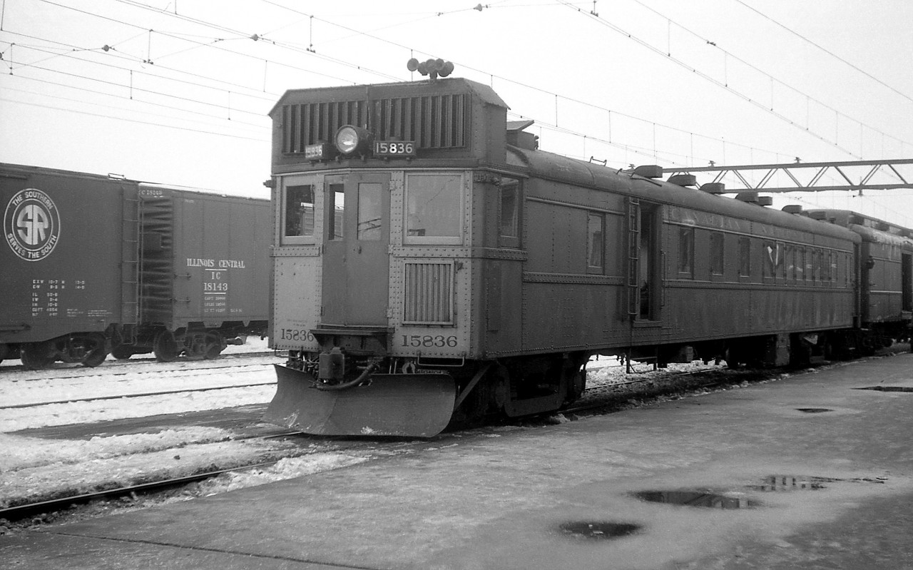 In the late 1950's, Canadian National used gas electric "doodlebugs" between London and Sarnia on occasion. Here we see CN 15836 at Sarnia station with a baggage car visible behind, under the overhead catenary wires for the St. Clair tunnel operation.