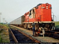 CN 3154 with West Bound Crash Bang Boom Train or better known as a Tempo Train Hoops orders from Operator Tom Needham at Komoka   May 1973