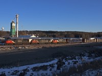 CN 317 rolls by the Cargill plant at Mount Albert with a nice variety of power.