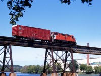 CP's Trenton Turn, with GP38-2 3042 working solo, takes one car across the Trent River bridge in Trenton.