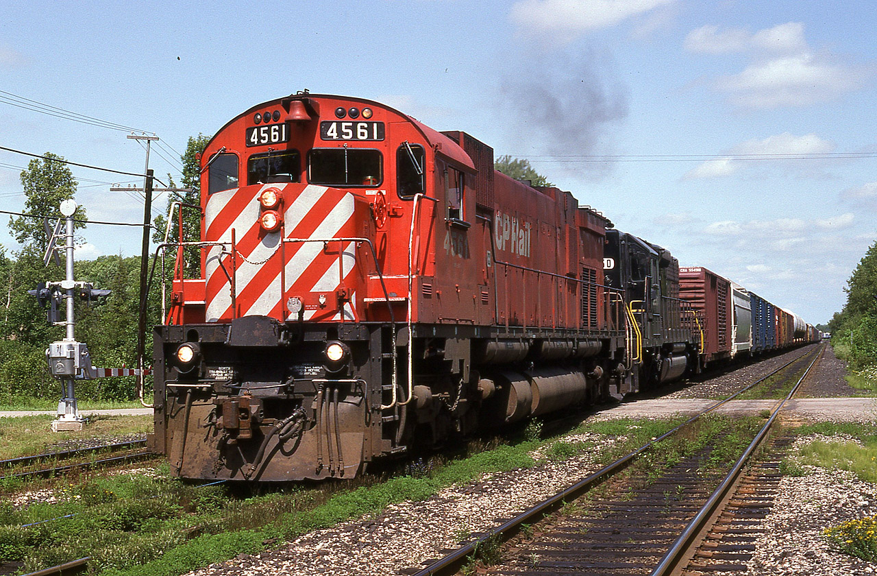 The daily westbound #923, or 'London Pickup' as some called it, often had interesting power. And it gave plenty of opportunities for photos. In this scene it has straddled 1st Line, as it works the jct.  The trailing unit behind CP 4561, the former NS 3250, now CP, was leased to CP and then purchased by them about a month before this photo was taken.