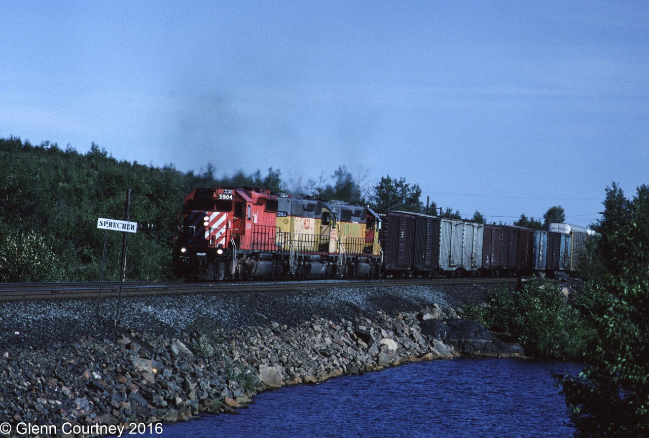 CPR 471 was a westbound out of Montreal that traveled up the now abandoned Ottawa Valley line before heading through North Bay and Sudbury on its way west. Sprecher is on the west side of Sudbury. Trailing 5904 are a pair of Helm Leasing units, obviously of Union Pacific heritage.