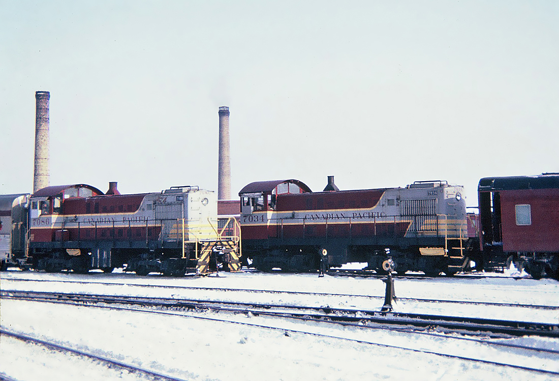 CP Alco S-2 No.7034 (1945), and MLW S-2 No.7086 (1949) switching passenger cars at CP's Glen yard, Montreal January 30, 1965.