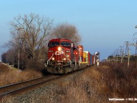 <b>FINALLY!!!</b>...and Happy New Year! Since having relocated to the Chatham area, I have found my luck being somewhat down in trying to photograph the busy Windsor Subdivision of the Canadian Pacific Railway. Out with my family, it was my wife who actually spotted this westbound...and behold, my luck had changed! CP 8653 and a second unidentified unit approach Third Line crossing at what the CP considers of being the small hamlet of Ringold.