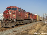 The years haven't been kind to Chatham's downtown core. Once prominent industries and mills that not only were served by the CP, seem to have vanished either due to relocation (including to the US) or closed due to the recent economic downturns. But it does have it's benefits, especially if you are a railfan. One can easily sit trackside at numerous spots in downtown Chatham, letting the imagination run wild of "what once was..." in passing time between trains.  Today, on a day not normally known to be this warm in January, the calmness of a lazy Sunday afternoon is broken by the grumblings led by the infamous GEVO's - 9718 being in the lead of this westbound freight.