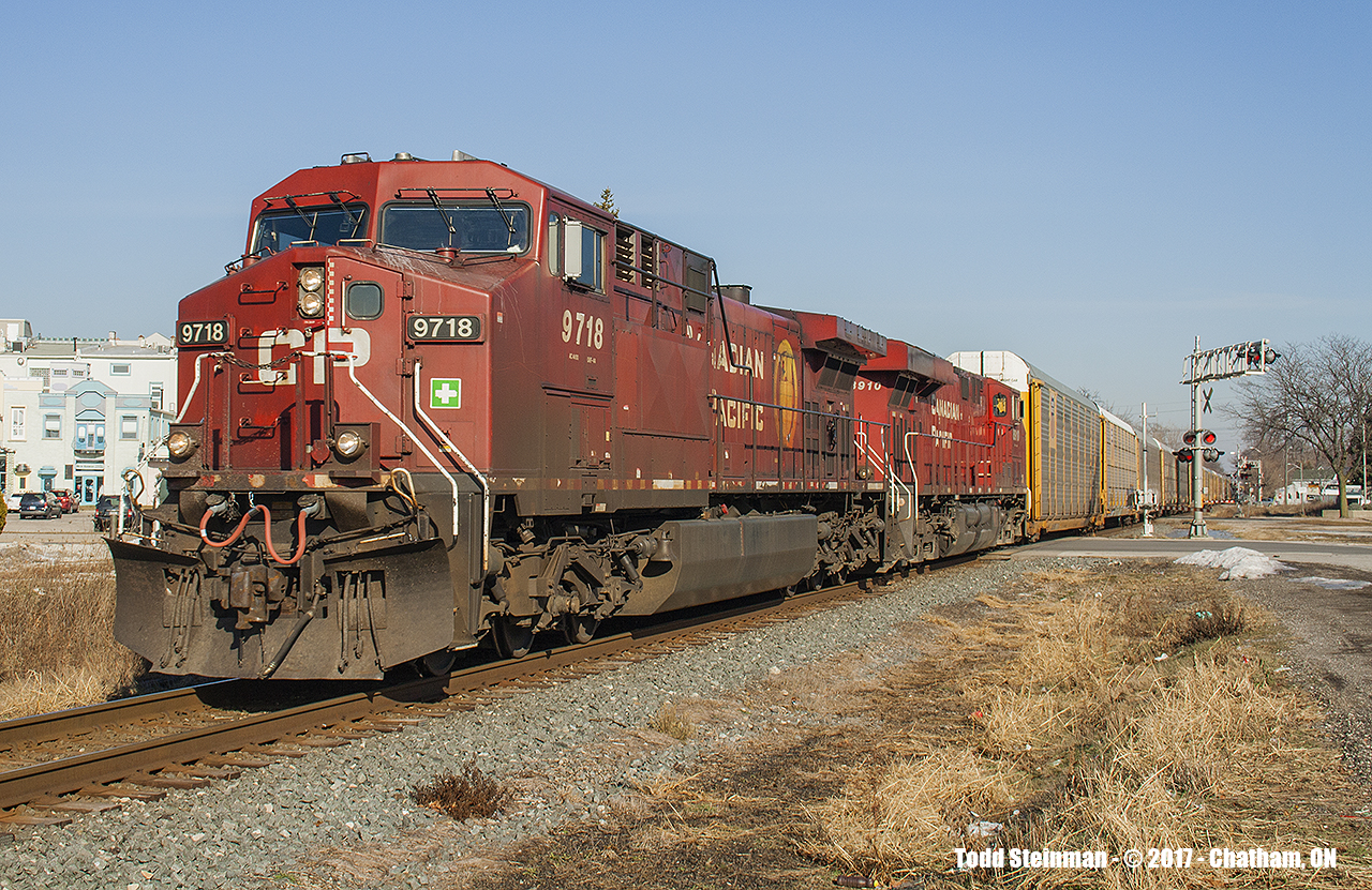 The years haven't been kind to Chatham's downtown core. Once prominent industries and mills that not only were served by the CP, seem to have vanished either due to relocation (including to the US) or closed due to the recent economic downturns. But it does have it's benefits, especially if you are a railfan. One can easily sit trackside at numerous spots in downtown Chatham, letting the imagination run wild of "what once was..." in passing time between trains.  Today, on a day not normally known to be this warm in January, the calmness of a lazy Sunday afternoon is broken by the grumblings led by the infamous GEVO's - 9718 being in the lead of this westbound freight.