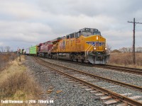 <b>ONE POPULAR TRAIN!</b> I guess that is what you get when you have a Southerner in the lead...UP 5506 with CP 8804 trailing as they lead train 647 through Tilbury on their way to Windsor.
<br>
<br>
Of note - the extra pickup of mixed freight from London. Alex Sanders photo shows this train of mostly tankers arriving for a crew change, and before the extra pickup seen here: <a href="http://www.railpictures.ca/?attachment_id=27606"> http://www.railpictures.ca/?attachment_id=27606 </a>
<br>
<br>
Kudos also to great 'round-the-bend' shots of CP 647 to both <a href="http://railpictures.ca/author/ja757"> http://railpictures.ca/author/ja757 </a> and <a href="http://railpictures.ca/author/bp0351"> http://railpictures.ca/author/bp0351 </a>  