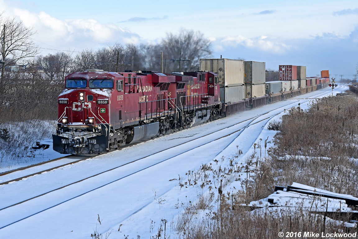Lightly frosted CP 8858 leads 8505 and 113's train past the siding at Lovekin (8538 is the DP today). Thank you tie pile. 1421hrs.