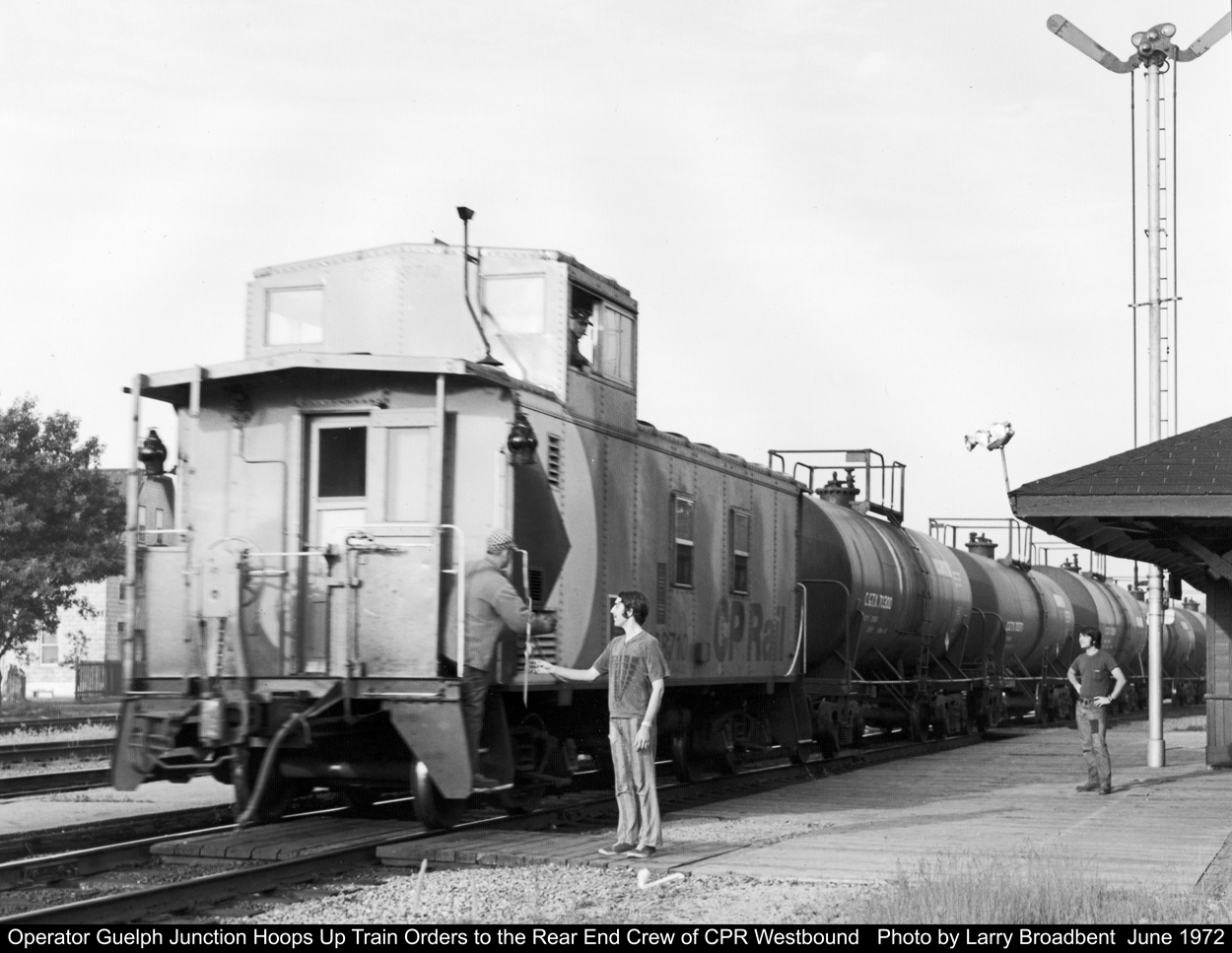 Guelph Junction Operator Hoops up Train Orders to a CP Westbound   June 1972