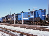 Beautiful sunny day many years ago in December of 1978 sees Conrail "Canadian Geeps" 7436 and 7437 and a van sitting out front of the Welland Yard office. This is now operated by CP.