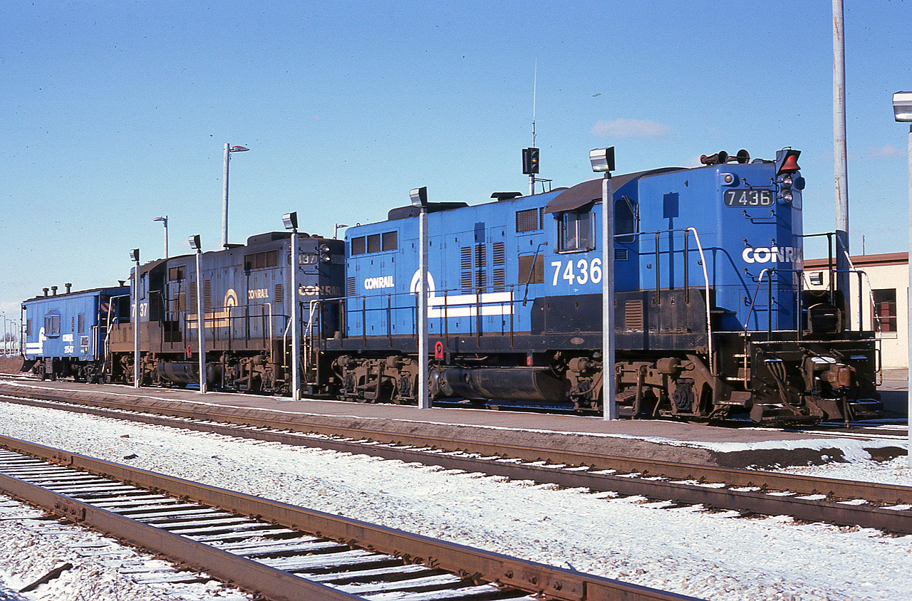 Beautiful sunny day many years ago in December of 1978 sees Conrail "Canadian Geeps" 7436 and 7437 and a van sitting out front of the Welland Yard office. This is now operated by CP.
