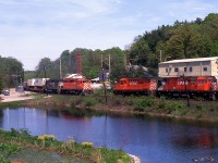 A bit of 'action' on the Galt sub!! Looking across the pond at Campbellville, we see CP 5521 and an unidentified NS leaser westbound as it crosses Guelph Line and meets CP 1858 and 4235, work train. Meets here were very hard for me to come by.