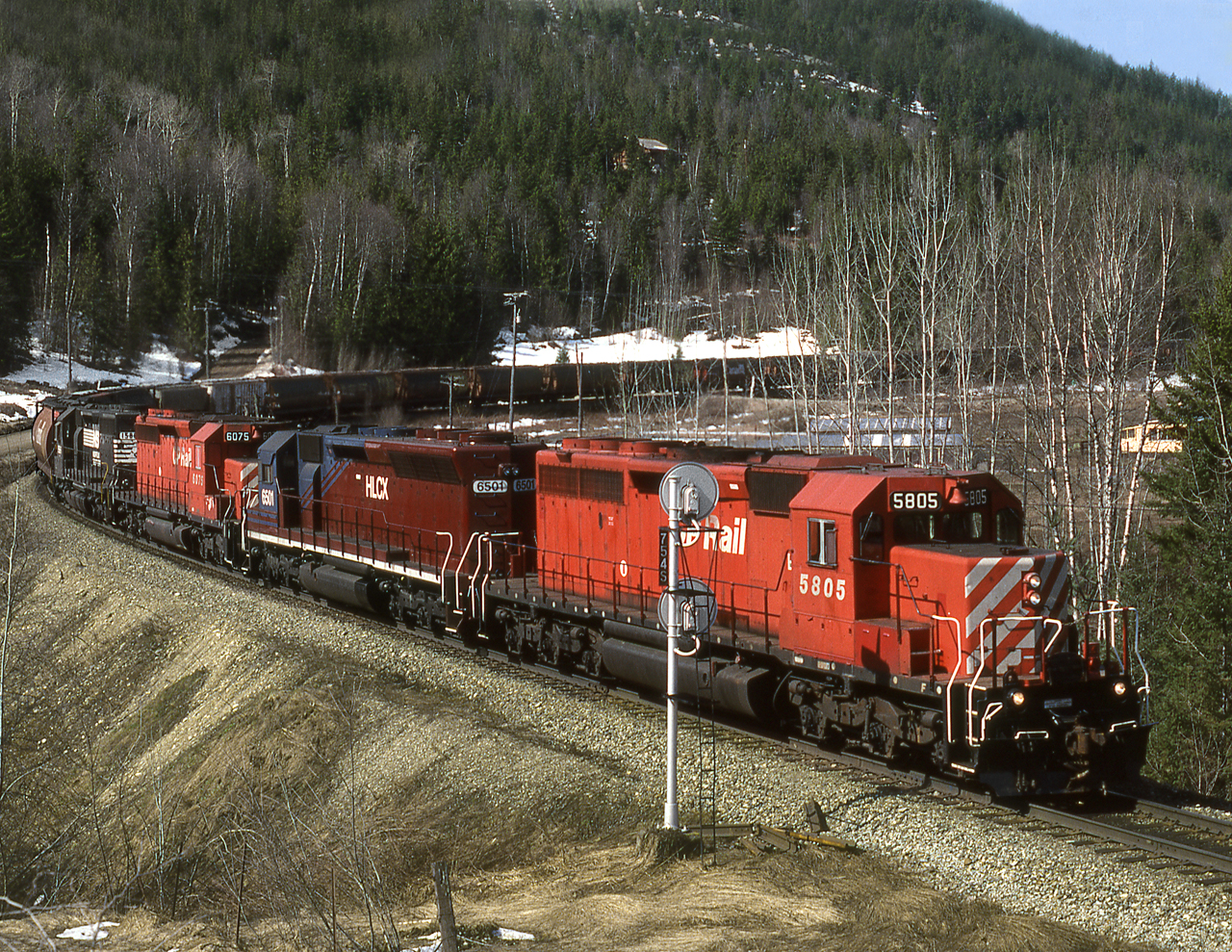 Grain empties approach Carlin siding on the south track from Notch Hill to Tappen on CP's Shuswap Sub. This was original main on a 2% grade. The north track buuilt in 1970's eased the grade to under 1% via a massive loop and is used for loaded westbound trains.