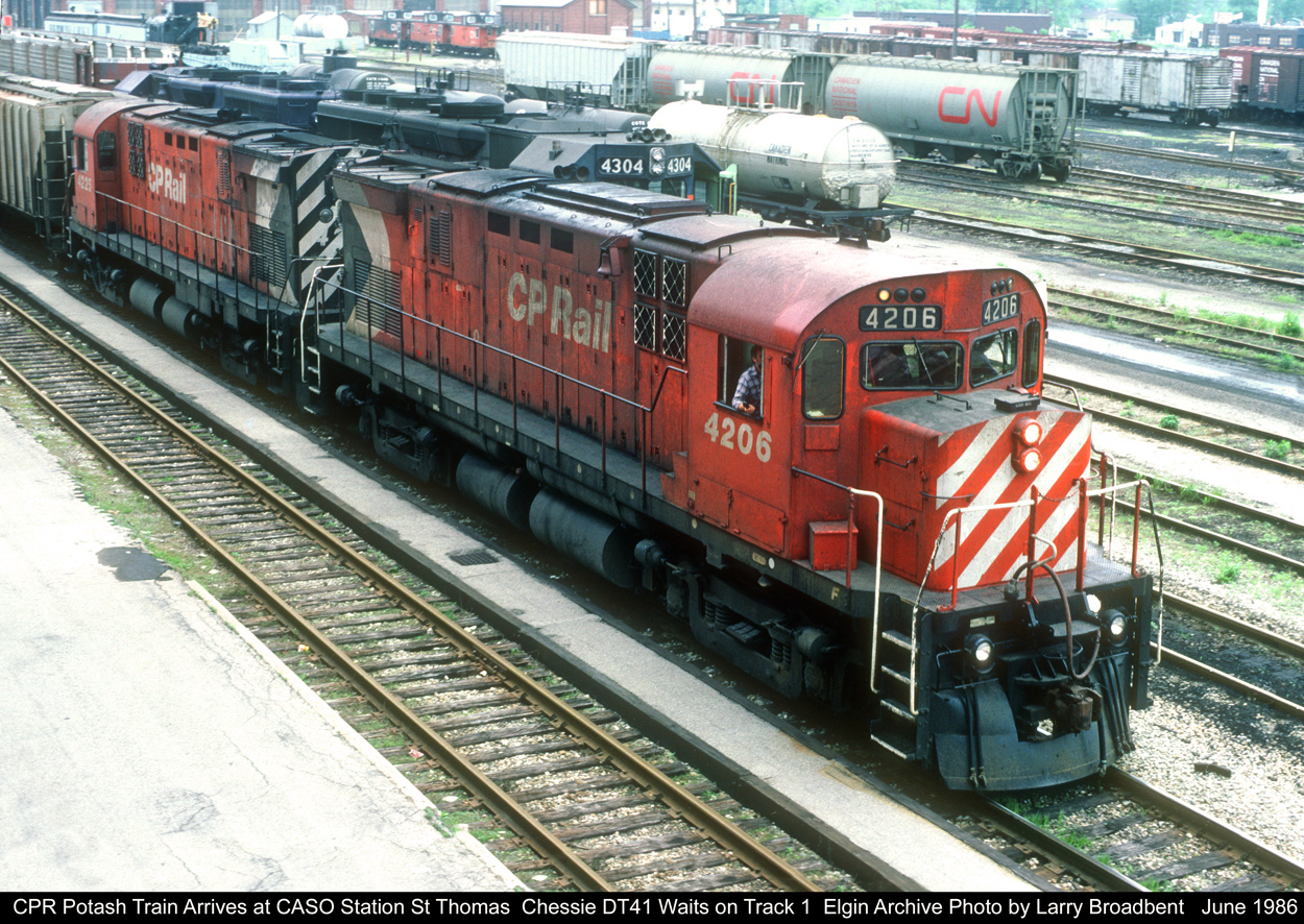 Busy day at the CASO Yard St Thomas. CP Potash Extra has arrived via the St Thomas Sub and is waiting for Chessie DT41 to head west after which they will yard their Train. Bill Foster CP Engineer..... June 1986