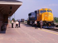 Its a nice sunny afternoon, and suits and staff are just coming out to check out the brand new ONR SD75I, the GMD unit that is going to hustle in a new era of locomotive efficiency on the railroad. The engine was on display at Englehart, and then was run up to Cochrane for another Open House. Spiffy looking unit, but I was rather surprised at $2.8 m each, or whatever they were, that a/c was optional!! So this #2100 was the first of six that would operate on the railroad, and sadly enough, this is the only one that has been scrapped. It was involved in a wreck in 2011 and subsequently retired.