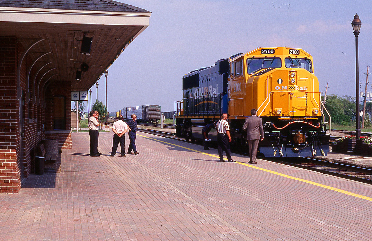 Its a nice sunny afternoon, and suits and staff are just coming out to check out the brand new ONR SD75I, the GMD unit that is going to hustle in a new era of locomotive efficiency on the railroad. The engine was on display at Englehart, and then was run up to Cochrane for another Open House. Spiffy looking unit, but I was rather surprised at $2.8 m each, or whatever they were, that a/c was optional!! So this #2100 was the first of six that would operate on the railroad, and sadly enough, this is the only one that has been scrapped. It was involved in a wreck in 2011 and subsequently retired.