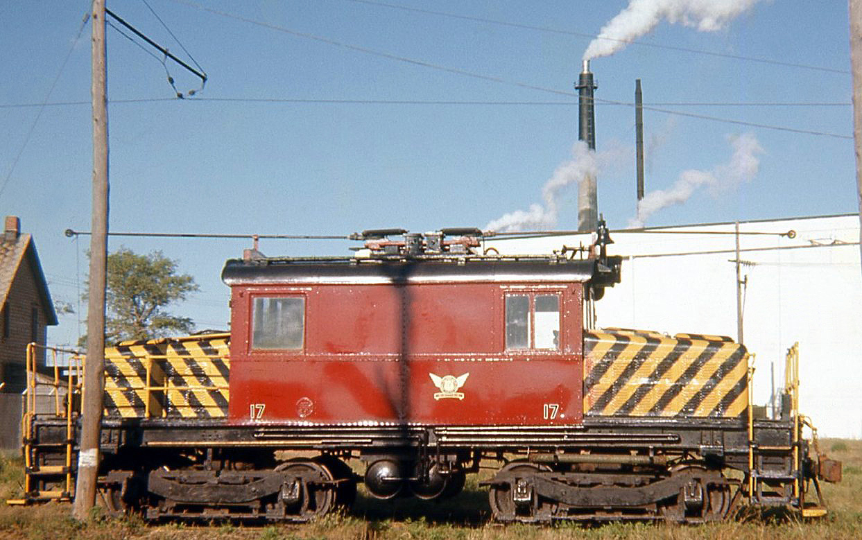 Cornwall Street Railway electric freight motor 17 (former Grand River Railway 230 acquired by the CSR in 1962, originally built by Balwdwin-Westinghouse in 1930 as Salt Lake and Utah RR 106) is seen here in 1967. CN acquired the electrified CSR in 1971 and converted it to diesel operations, but freight motor 17 was saved and today resides on display in front of the Cornwall filtration plant.

(Geotagged location not exact).