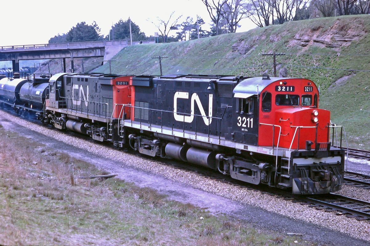 A pair of CN C-424's are coming off the Dundas Sub at Bayview Jct. in May 1968.