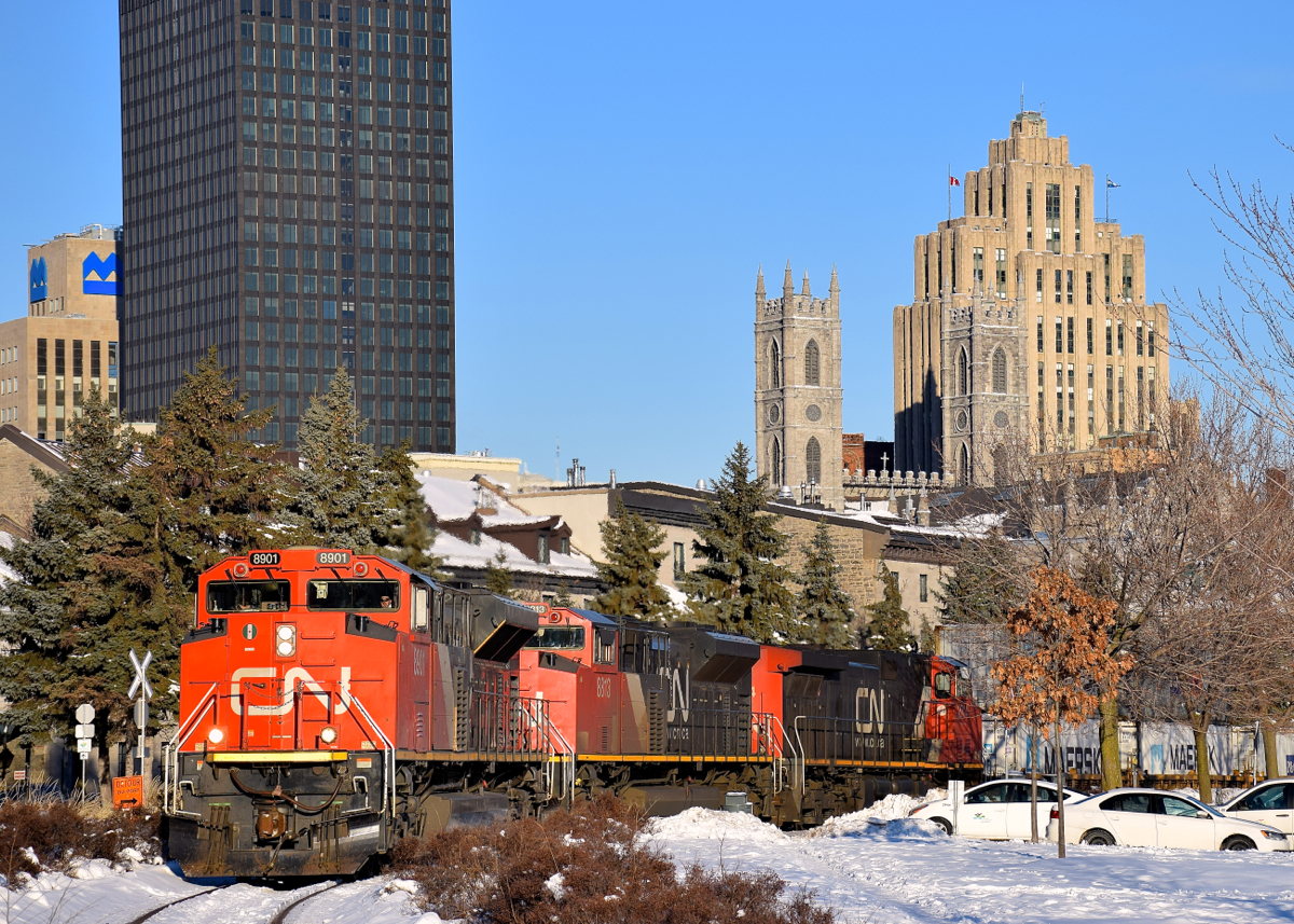 CN 8901, CN 8813 & IC 2714 lead CN 149 out of the Port of Montreal as they round a curve on a sunny but cold morning.