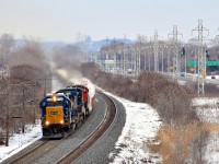 Ex-Seaboard SD50 CSXT 8534 is still earning its keep 33 years after being built as it leads CN 327 through Beaconsfield on CN's Kingston Sub. Trailing are two Dash8-40CW veterans, ex-Conrail CSXT 7318 & ex-ATSF CN 2175.