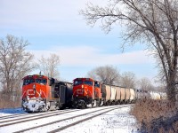CN 369 at left and CN X371 at right are both stopped at Dorval, waiting for permission to head west. They are delayed due to an incident involving VIA 61 in Coteau which delayed all VIA Rail and CN freight trains this morning. A few minutes after I took this photo CN 369 would depart, with CN X371 following about a half hour later.