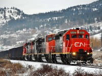 CN returned to operation of the Okanagan sub in Dec.2013. Initially and before upgrading of the track only four axle locos were used, and this shot shows four such units running alongside Hwy97 and approaching Vernon from the north. The units seen are WC 3026,3027, CN 9551 & IC 3140.